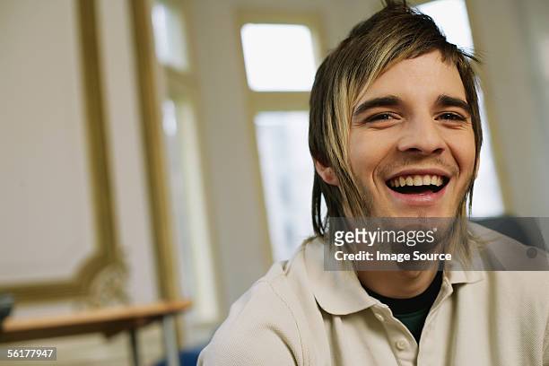 young man laughing - mullet haircut stock pictures, royalty-free photos & images