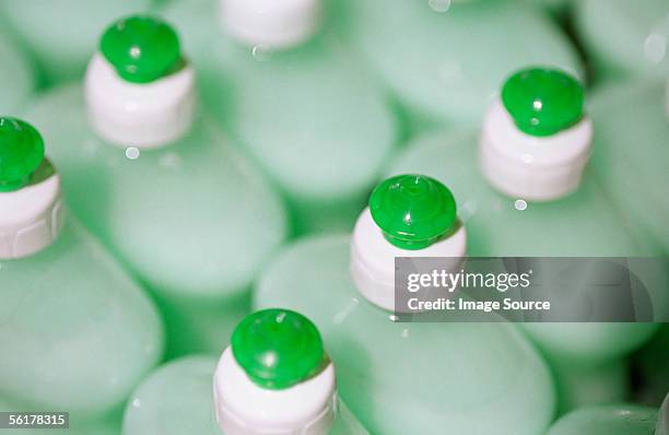 row of washing up bottles - detergente líquido fotografías e imágenes de stock