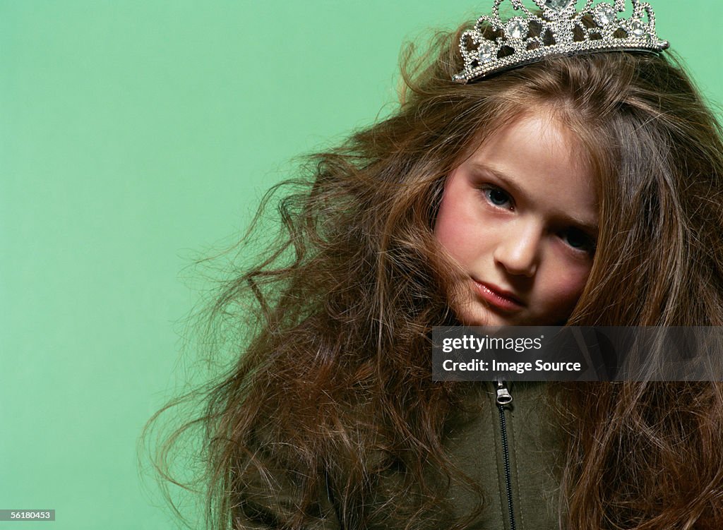 Sulky girl wearing a tiara