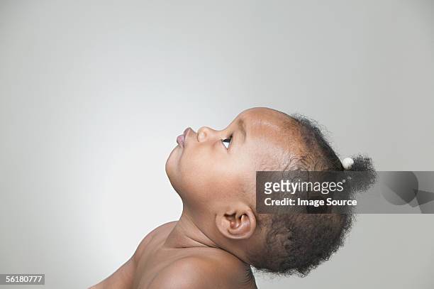profile of a baby girl - baby studio shot stock pictures, royalty-free photos & images