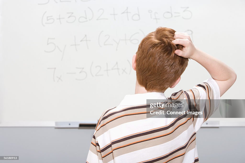 Boy puzzled by maths problem