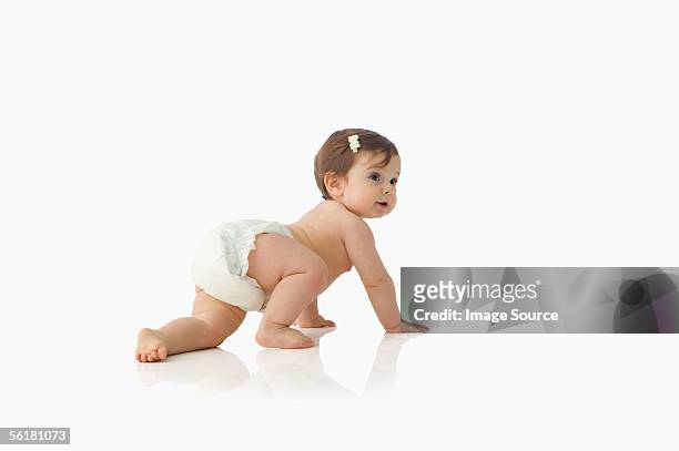 baby girl crawling - 這う ストックフォトと画像