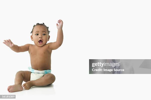 baby waving his arms - diaper boy fotografías e imágenes de stock