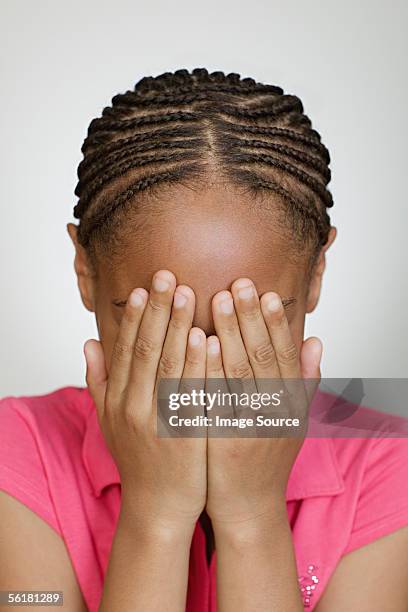 girl covering her face - braided hairstyles for african american girls stock pictures, royalty-free photos & images