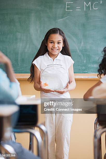girl giving a presentation in classroom - goldfish bowl stock pictures, royalty-free photos & images