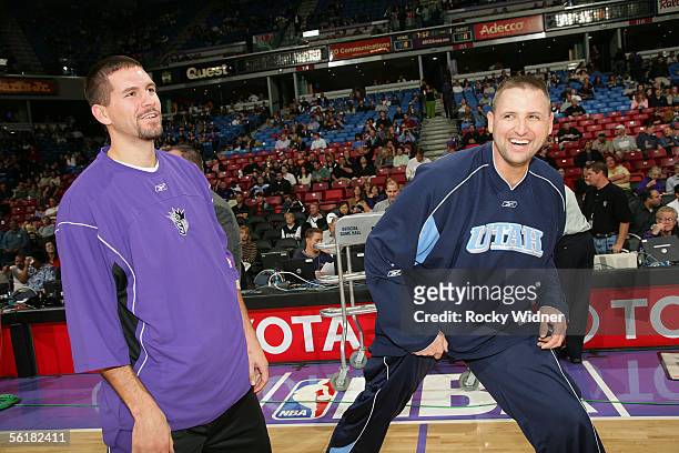 Brad Miller of the Sacramento Kings meets with former teammate Greg Ostertag of the Utah Jazz on November 15, 2005 at ARCO Arena in Sacramento,...