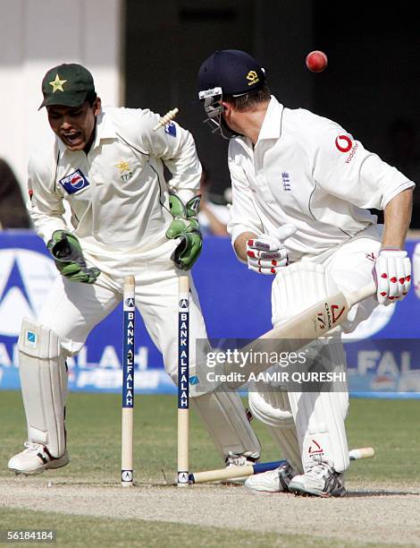 England batsman Shaun Udal is bowled out by Pakistani leg spinner Danish Kaneria as wicketkeeper Kamran Akmal reacts during the fifth and last day of...