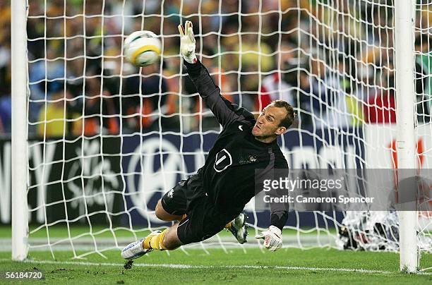Mark Schwarzer of the Socceroos makes a save in the penalty shoot-out during the second leg of the 2006 FIFA World Cup qualifying match between...
