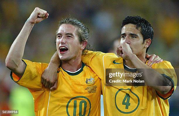 Harry Kewell and Tim Cahill of the Socceroos celebrate winning the second leg of the 2006 FIFA World Cup qualifying match between Australia and...