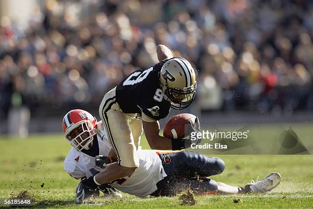 Wide receiver Dorien Bryant of the Purdue Boilermakers fights off a tackler against the Illinois Fighting Illini at Ross-Ade Stadium on November 12,...