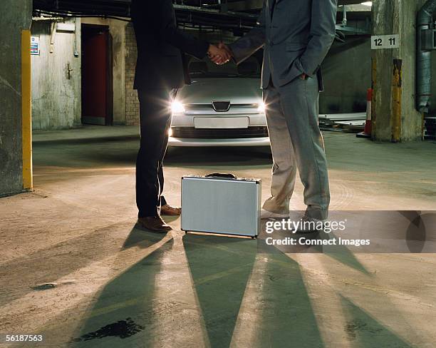 a shady deal - bestechung stock-fotos und bilder