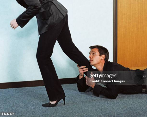 man grabbing woman's leg - stiletto stock pictures, royalty-free photos & images