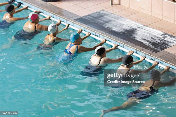 women swimming - water aerobics stock pictures, royalty-free photos & images