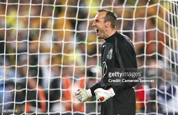 Mark Schwarzer of the Socceroos celebrates saving a goal during the penalty shootout the second leg of the 2006 FIFA World Cup qualifying match...