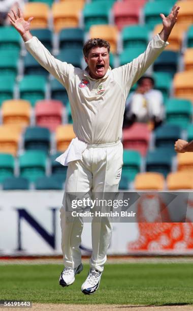 Stuart MacGill of Australia celebrates the wicket of Shivnarine Chanderpaul of the West Indies during day one of the Second Test between Australia...