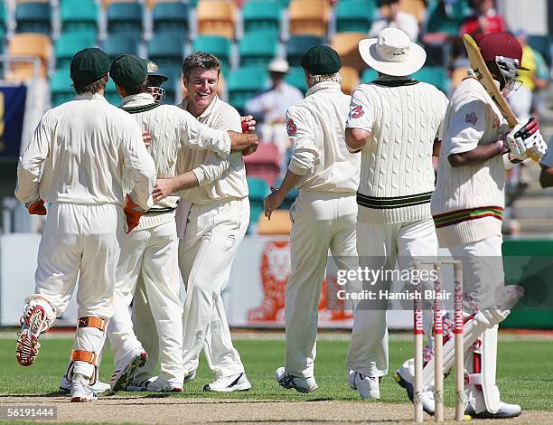 Stuart MacGill of Australia celebrates the wicket of Dwayne Bravo of the West Indies with team-mates during day one of the Second Test between...