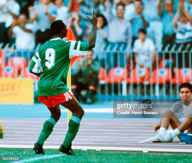 Roger Milla of Cameroon celebrates scoring his first goal during the World Cup eighth final match between Cameroon and Colombia at the San Paolo...