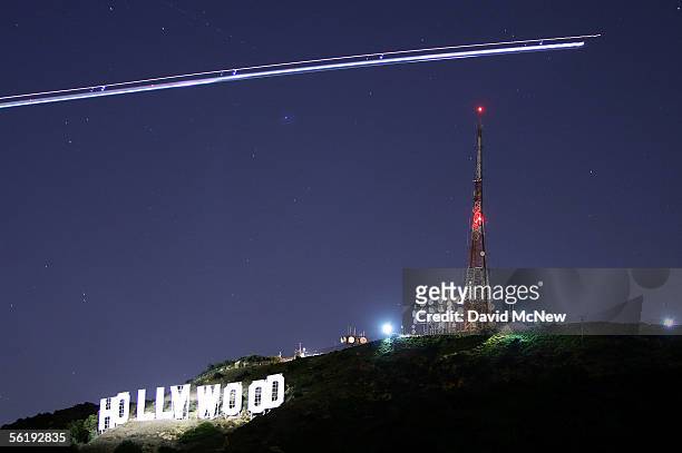 The Hollywood Sign is illuminated by the spotlight of a helicopter streaking past the sign at night on November 16, 2005 in Los Angeles, California....