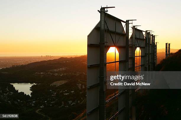 Day turns to night at the Hollywood Sign on November 16, 2005 in Los Angeles, California. The historic landmark is undergoing a month-long makeover;...
