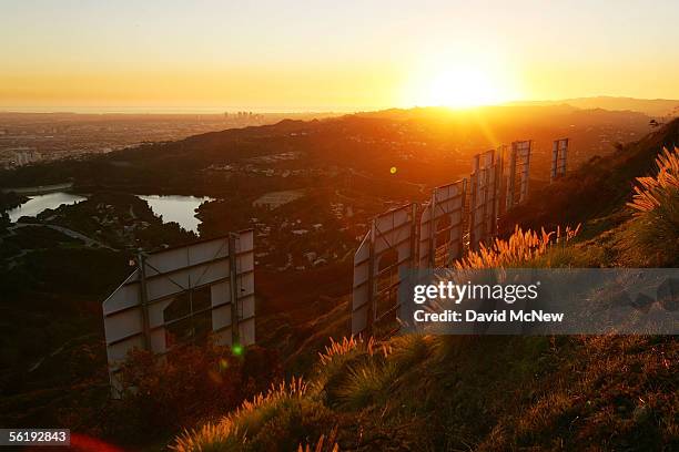 Day turns to night at the Hollywood Sign on November 16, 2005 in Los Angeles, California. The historic landmark is undergoing a month-long makeover;...