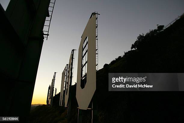 Day turns to night at the Hollywood Sign on November 16, 2005 in Los Angeles, California. The historic landmark is undergoing a month-long makeover;...