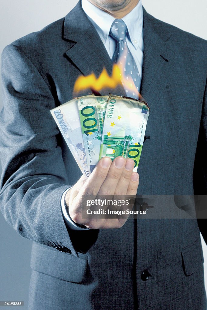 Man burning money