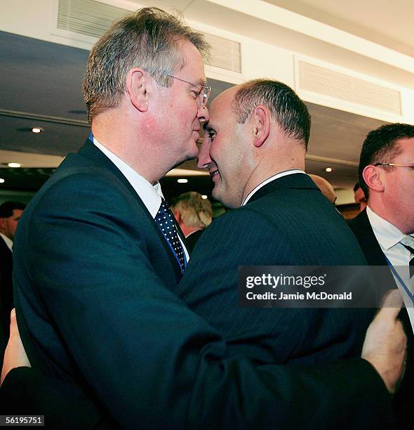 New Zealand Rugby Union Chairman Jock Hobbsis congratulated by Bernard Lapasset of France after the announcement that New Zealand will host the 2011...