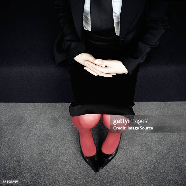 businesswoman's lap - heels hand stock-fotos und bilder