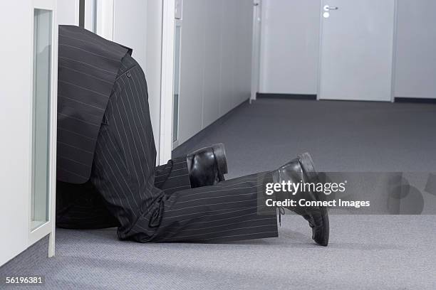 businessman crawling on floor - krabbeln stock-fotos und bilder