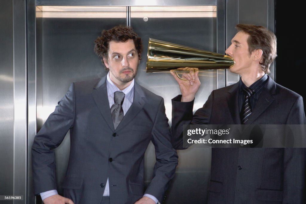 Businessman using a megaphone