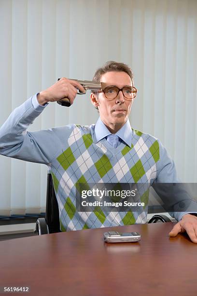 man holding gun to head - nerd sweater stock pictures, royalty-free photos & images