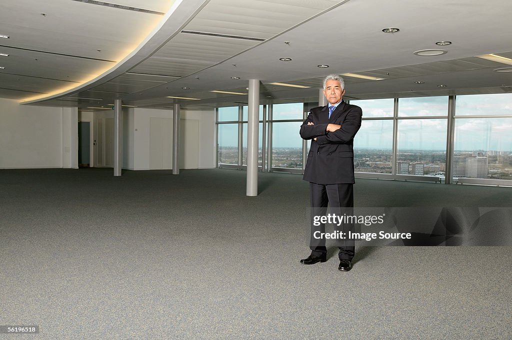 Asian businessman in empty office