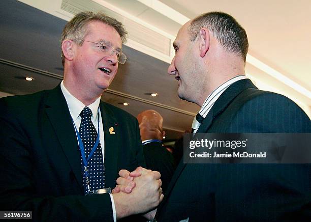 New Zealand Rugby Union Chairman Jock Hobbsis congratulated by Bernard Lapasset of France after the announcement that New Zealand will host the 2011...