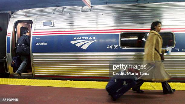 Passengers walk to board an Amtrak train in Penn Station November 17, 2005 in New York City. Transportation Secretary Norman Y. Mineta said today...