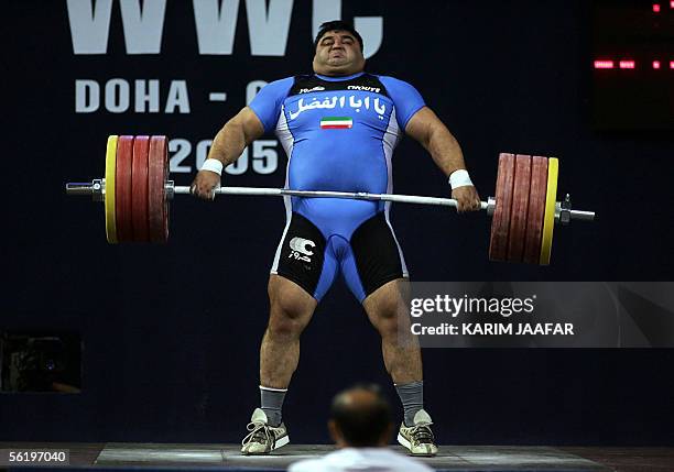 Iran's Hossein Rezazadeh competes in the +105kg category on the final day of the Centennial World Weightlifting Championships 17 November 2005 in...