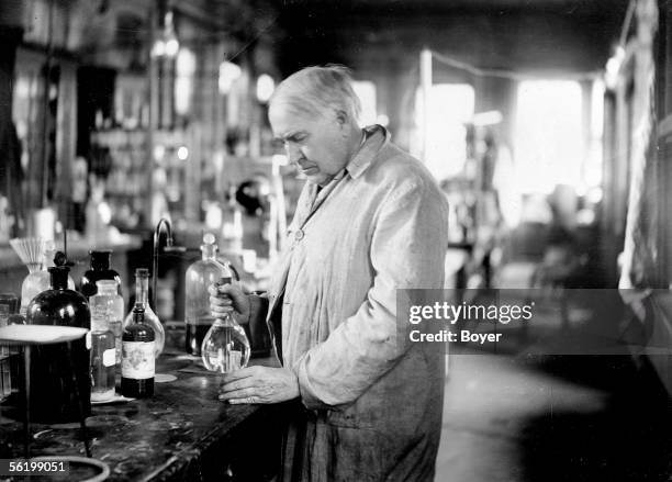Thomas Edison , American inventor, in his chemistry laboratory. 1917.
