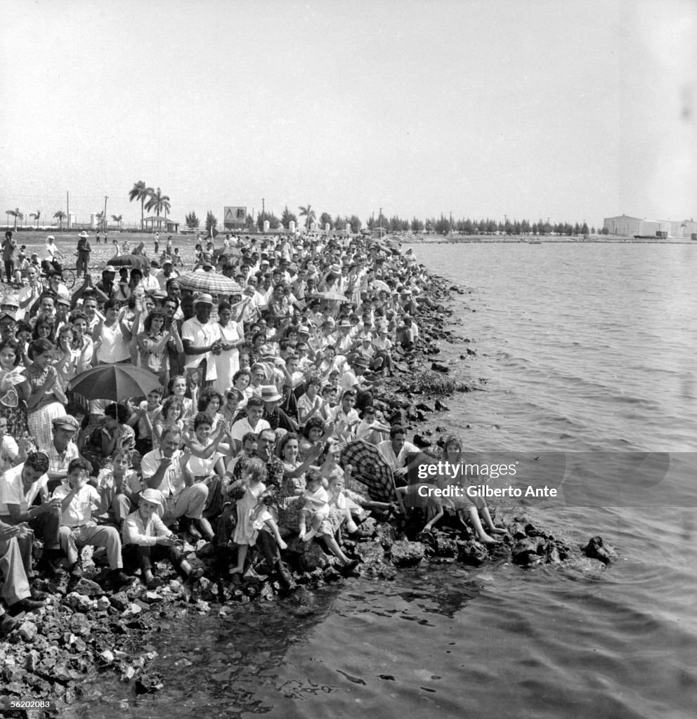 Crowd during the launching of a boat by Fidel Cast