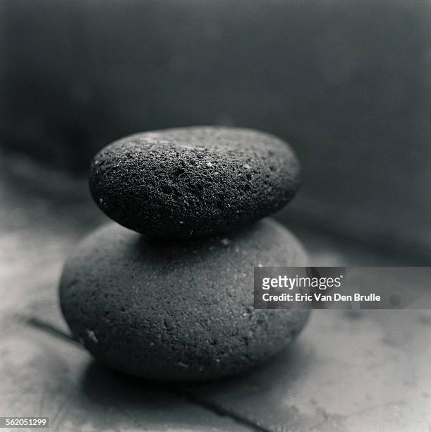 stacked black stones - eric van den brulle ストックフォトと画像