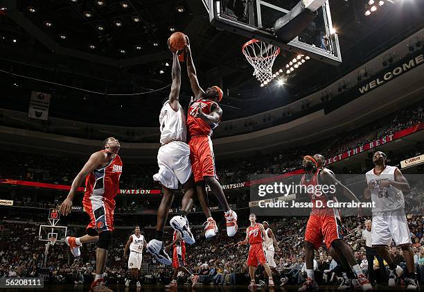 Jumaine Jones of the Charlotte Bobcats blocks a shot attempt against Chris Webber of the Philadelphia 76ers November 4, 2005 at the Wachovia Center...