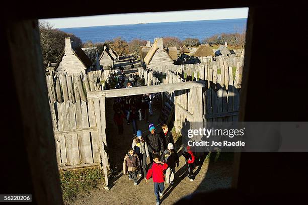 People visit the 1627 Pilgrim Village at "Plimoth Plantation" where role-players portray Pilgrims seven years after the arrival of the Mayflower...