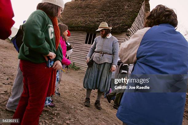 Visitors meet a local at the 1627 Pilgrim Village at "Plimoth Plantation" where role-players portray Pilgrims seven years after the arrival of the...