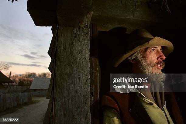 John Billington stands in the doorway to his home at the 1627 Pilgrim Village at "Plimoth Plantation" where he and other role-players portray...