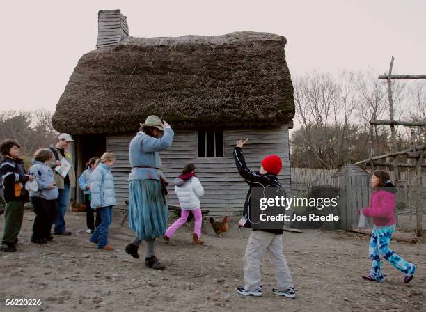 Visitors meet a local at the 1627 Pilgrim Village at "Plimoth Plantation" where role-players portray Pilgrims seven years after the arrival of the...