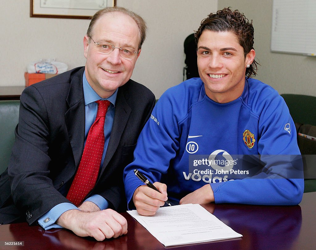 Cristiano Ronaldo of Manchester United poses with Finance Director