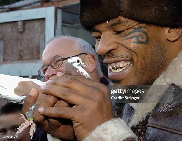 Former world heavyweight boxing champion Mike Tyson meets up with a pigeon fancier Horace Potts , of Bloxwich, Walsall, West Midlands on November 18,...