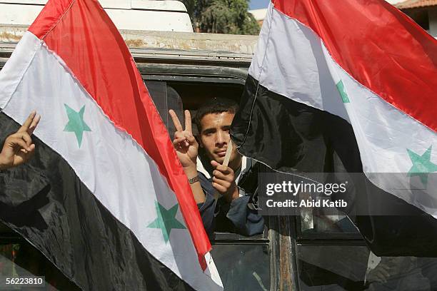 Palestinian youth holds a Syrian flag during a pro-Syrian demonstration on November 18, 2005 in Gaza City, Gaza Strip. Hundreds of Palestinians...