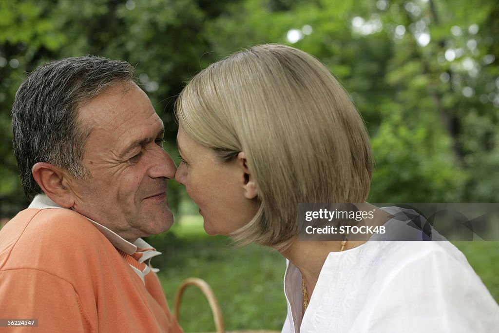 Mature couple rubbing noses