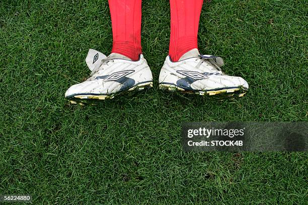 football boots on the grass - studded stock pictures, royalty-free photos & images