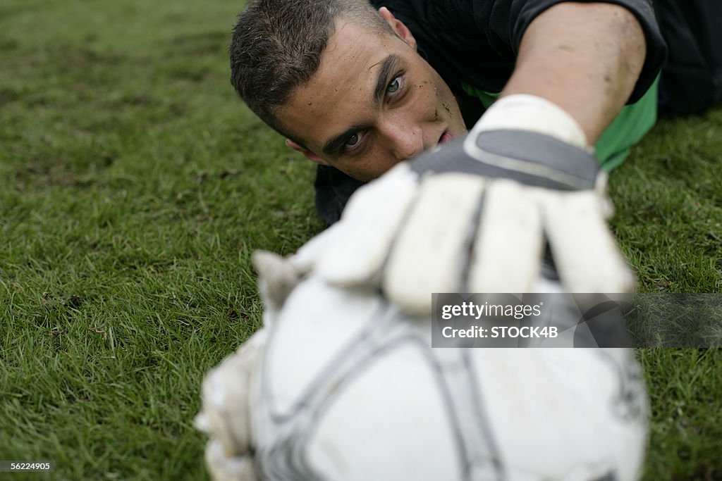 Goalkeeper catching a football