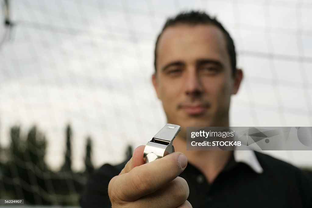 Referee holding Whistle